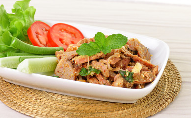 Thai food, spicy pork with chili and mint