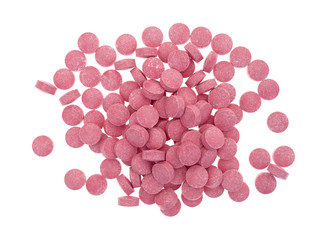 Small vitamin B12 tablets on a white background