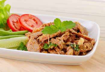 Thai food, spicy pork with chili and mint