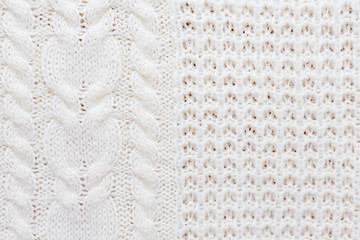 Abstract knitted background. Wool white sweater texture. Close up picture of  knitted pattern.