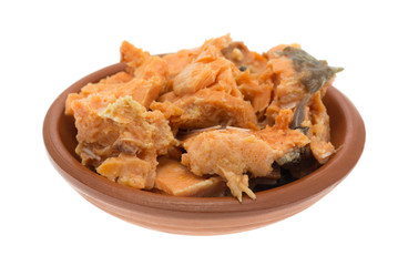 Canned salmon in a small dish