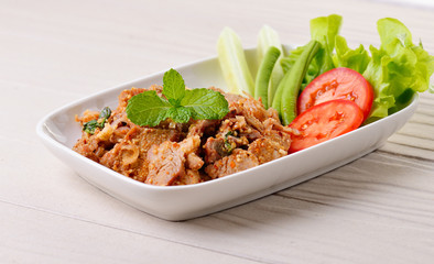 Thai food, spicy pork with chili and mint