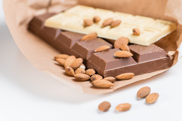white and dark chocolate, almonds, cinnamon, cocoa. shallow DOF