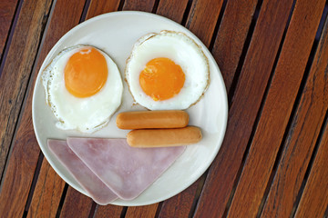 breakfast meal with ham sausage and egg