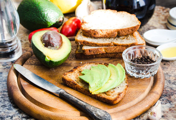 toast with fresh avocado and pepper, healthy snack, vegetarian f