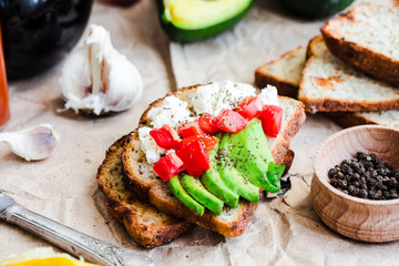toast with fresh avocado, tomato and goat cheese, vegetarian sna