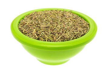 Bowl of rosemary leaves on a white background