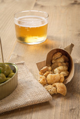 Beer cap and olives pork rinds