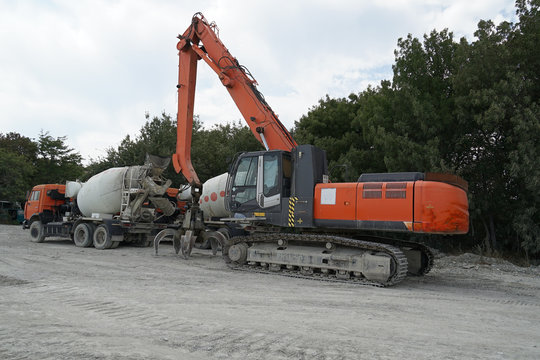 excavator, concrete mixer