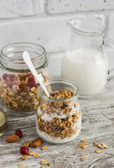 Homemade granola and natural yoghurt on a light wooden surface. Healthy food, healthy Breakfast or snack