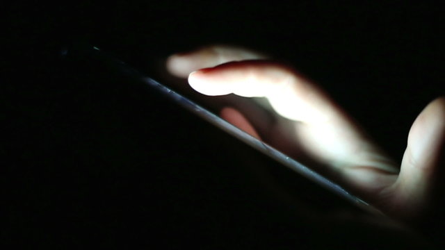 hands chatting alone at dark with smartphone, online talking with friends communicating