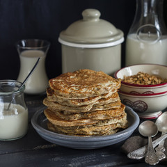 Healthy breakfast or snack - whole grain pumpkin pancake, on a dark wooden table
