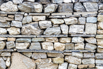 Fototapeta premium Old stone wall with different shapes and texture