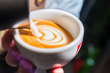 preparation of cappuccino with decoration