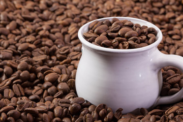 Coffee beans and cup of coffee