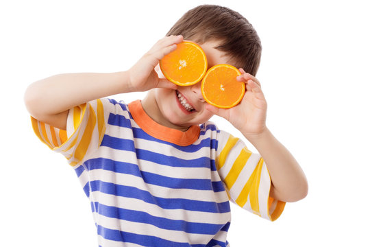 Funny boy with fruits on eyes