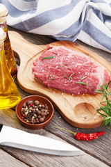 Raw beef steak and spices