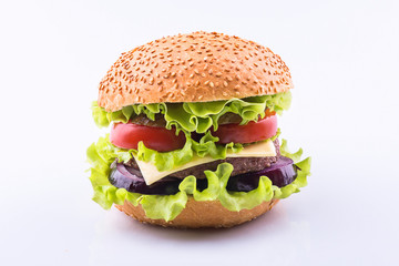Big burger with beef cutlet and fresh vegetables isolated on white background