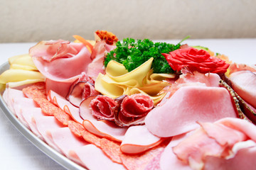 Food tray with eggs, ham, sausage and vegetable
