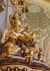 Fototapeta na wymiar Vienna - Sculpture of Holy Trinity on the pulpit of baroque st. Peter church