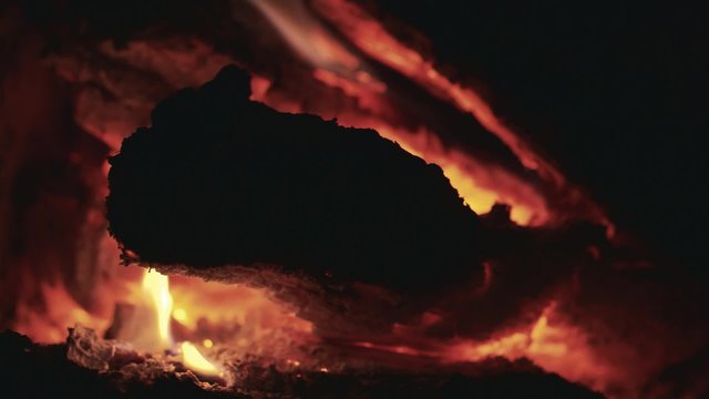 Burning wood in the fireplace