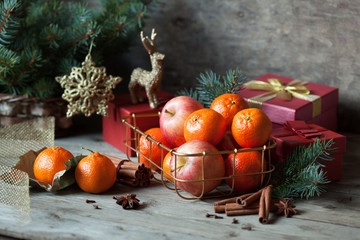 Christmas gifts boxes and fruit , tangerines , apples