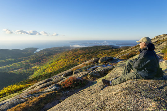 Mature Man Enjoying View from Mountain