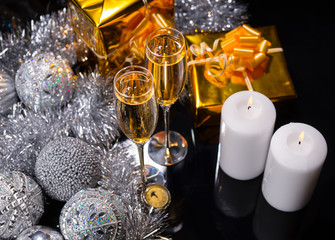 Lit Candles with Glasses of Festive Champagne