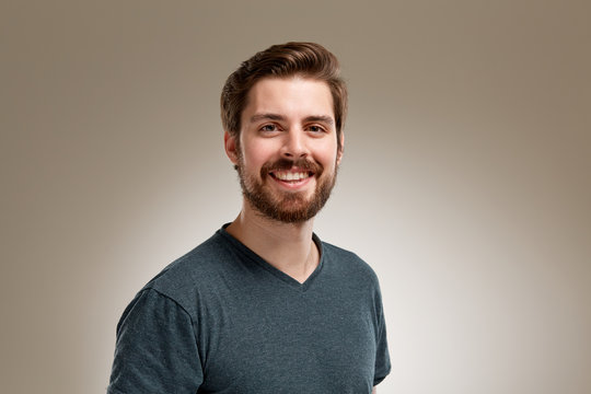 Smiling young man with beard