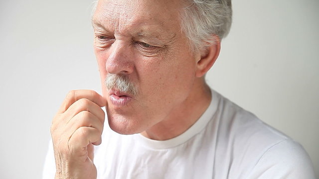 A senior man has itchy skin on his face.