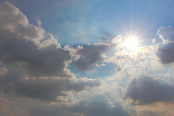 blue sky with clouds and sun