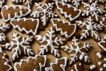 Christmas gingerbread on a light wooden background, clouse up