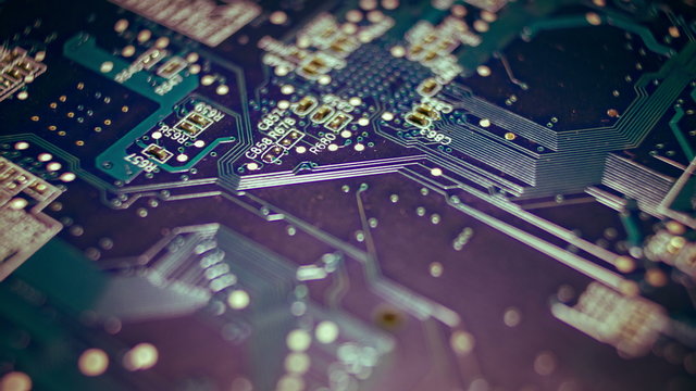 4K close up macro computer motherboard chips circuits surface rotating dolly