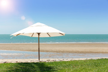 Umbrella On The Beach On Sunny Day