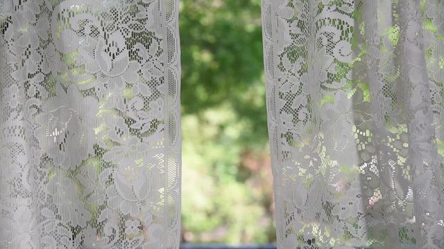 lace curtains blowing in the wind
