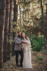 beard man and nice woman in the wood