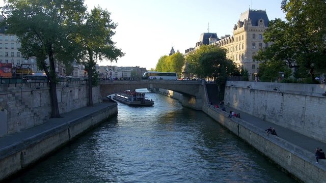 Paris, pont St Michel before sunset with riverboat