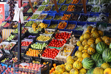 Greengrocers' shop, with an electronic scale, and various boxes and crates with fresh fruit and vegetables on display