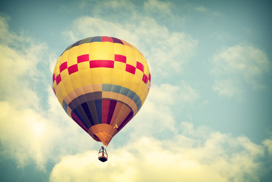Hot air balloon on sky with cloud, vintage color effect