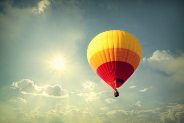 Hot air balloon on sky with cloud, vintage retro filter effect