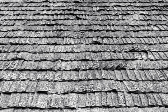 Black and white picture of weathered wooden roof tiles