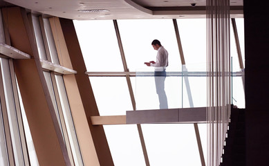 young successful business man in penthouse apartment working on