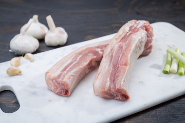 raw pork belly on marble cutting board 7