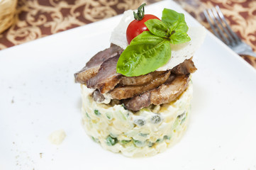 salad with meat on a table in a restaurant