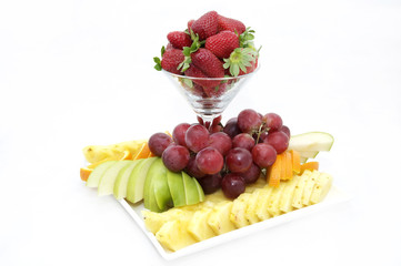  large plate of sliced fruit on white background