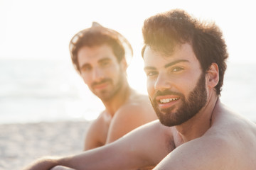 Portrait. Couple of friends at sunset on the beach on a day of rest summer vacation together, after spending a day of relaxation and fun