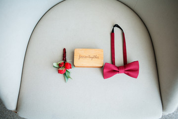 Boutonniere and bow tie. Wedding accessories