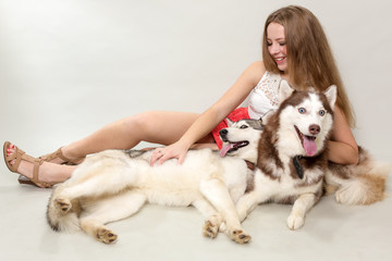 Girl with two dogs Siberian husky