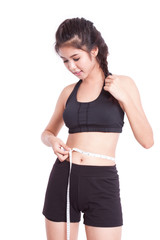 Fitness young woman taking measurements of her body. healthy concept