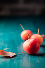 Red apples and leaves Wooden blue, turquoise background